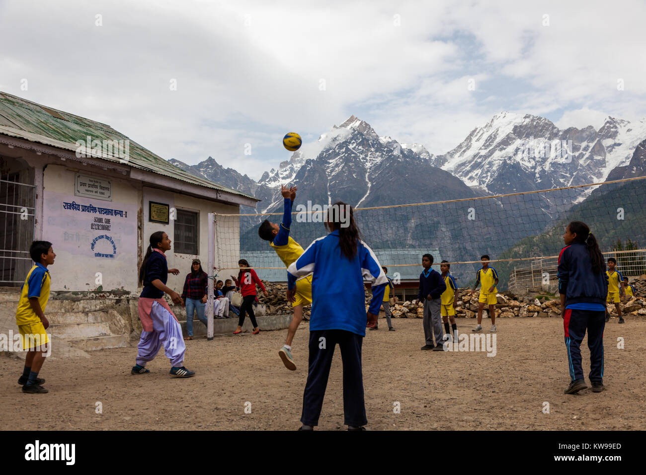 School children playing volleyball in school premise at Kalpa, Himachal