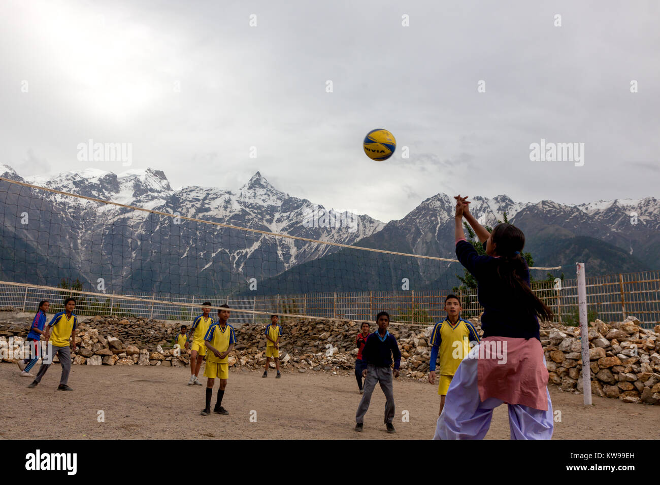 School children playing volleyball in school premise at Kalpa, Himachal