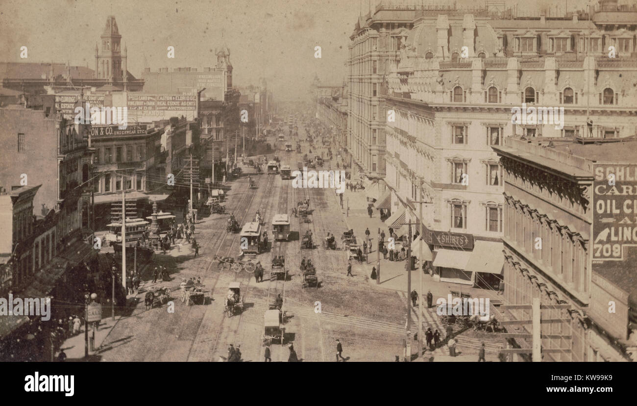 Market Street, San Francisco, California, circa 1895 - Photo shows a bird's-eye view of Market Street in San Francisco, California, with many horse-drawn carriages and cable cars, along with pedestrians on the broad street between commercial buildings. Stock Photo