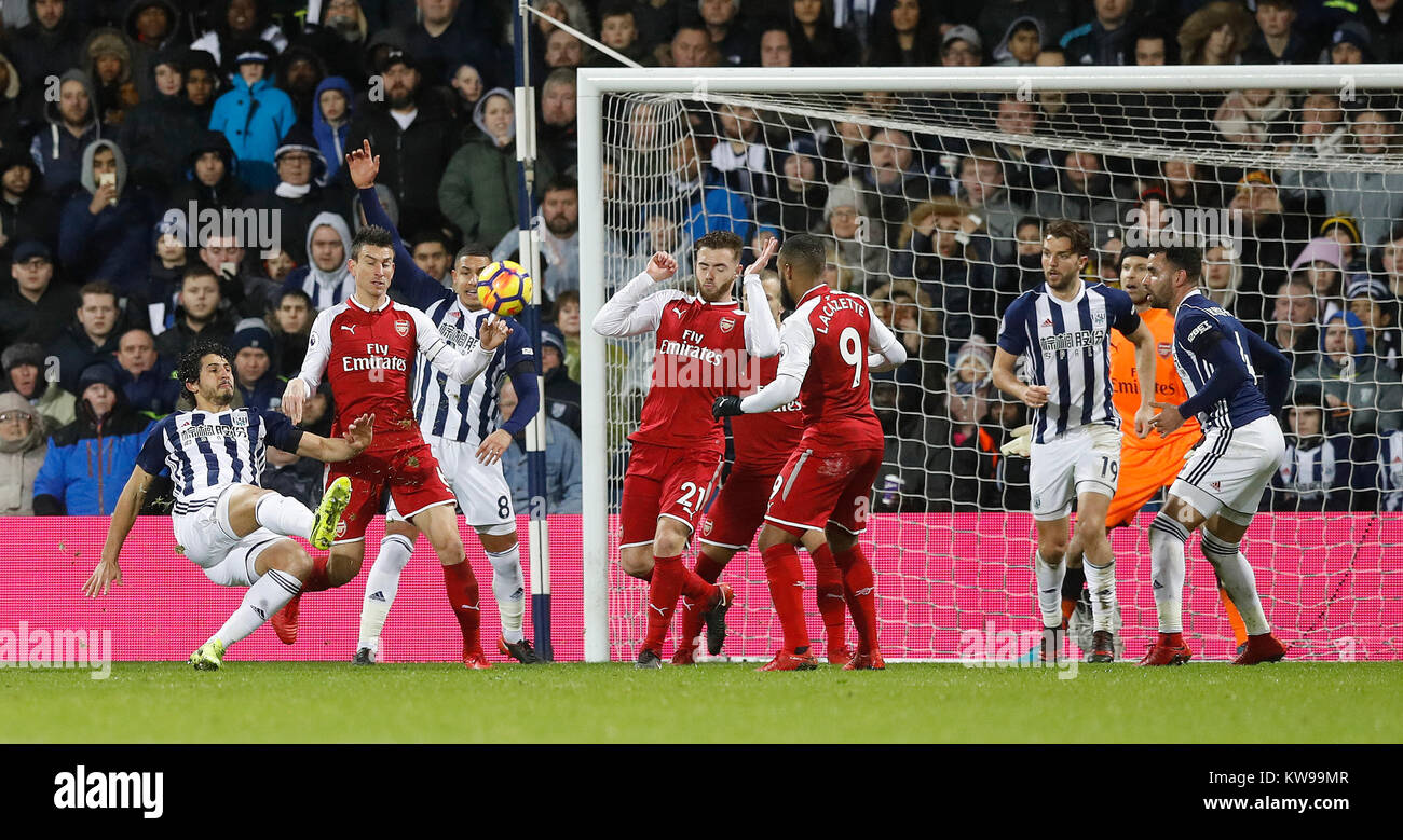 West Bromwich Albion's Ahmed Hegazy (left) shoots during the Premier League match at The Hawthorns, West Bromwich. Stock Photo