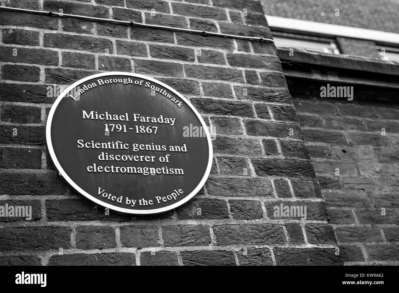 Plaque celebrating scientist Michael Faraday on side of Walworth Clinic, on Larcom Street, London. Stock Photo