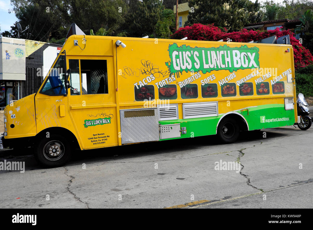 Gus's Lunch Box Mexican food cart yellow truck van parked at lunchtime in the Silver Lake neighborhood of Los Angeles, California USA   KATHY DEWITT Stock Photo