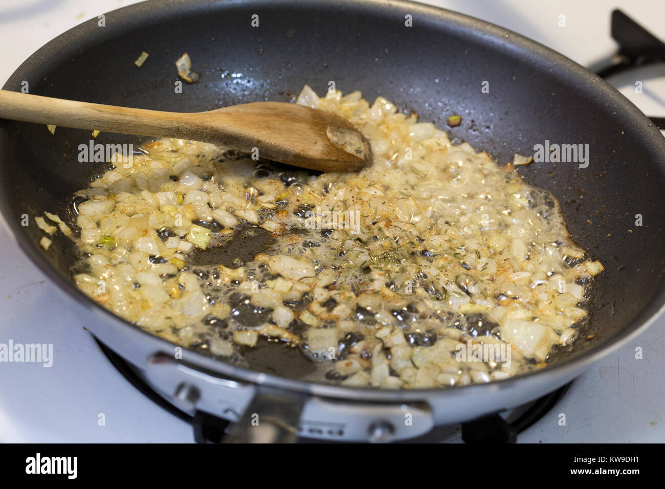 Splitting a head of cabbage, for a cauliflower gratin Stock Photo