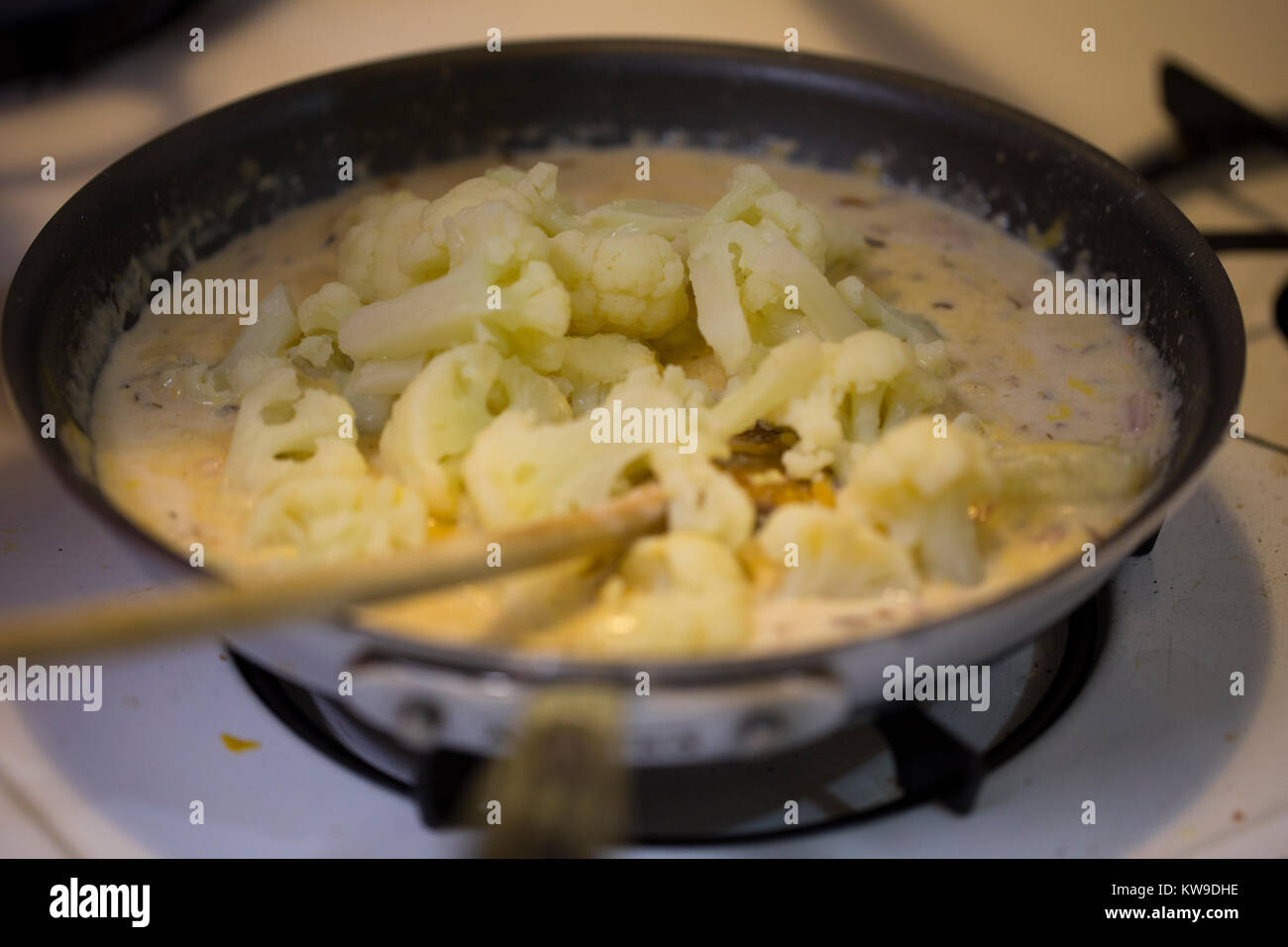 stove top cooking a cauliflower gratin Stock Photo