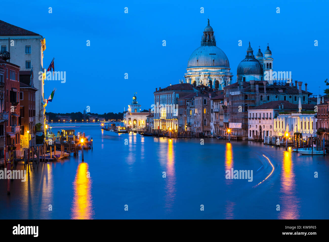 Basilica di Santa Maria della Salute and Punte della Dogana, Grand Canal  Venice, Veneto, Italy, at blue hour, dusk, twilight, evening, Stock Photo