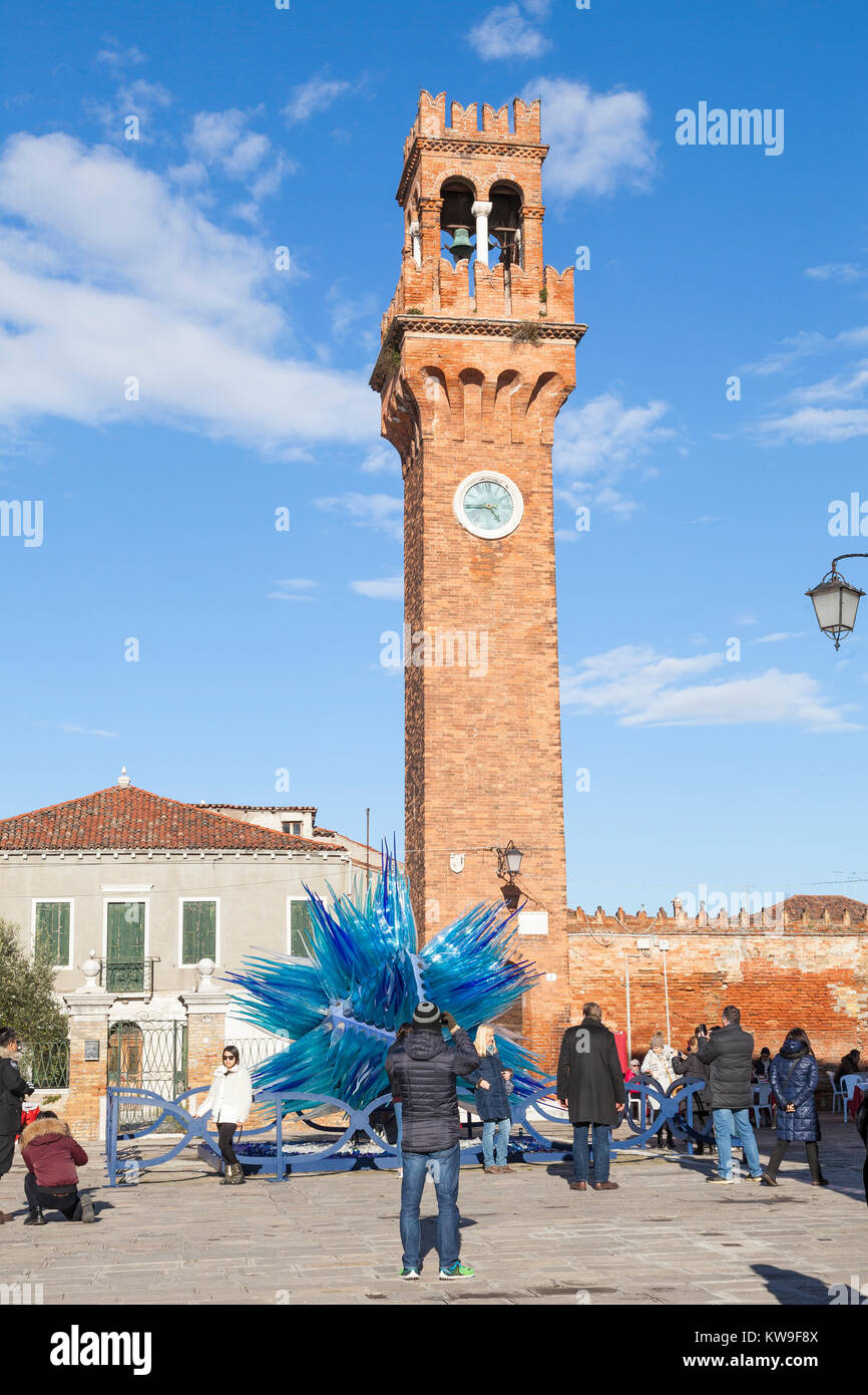 Murano, Venice, Italy, tourists viewing  Campo San Stefano, the Clock Tower  and Comet Glass Star by Simone Cenedese Stock Photo