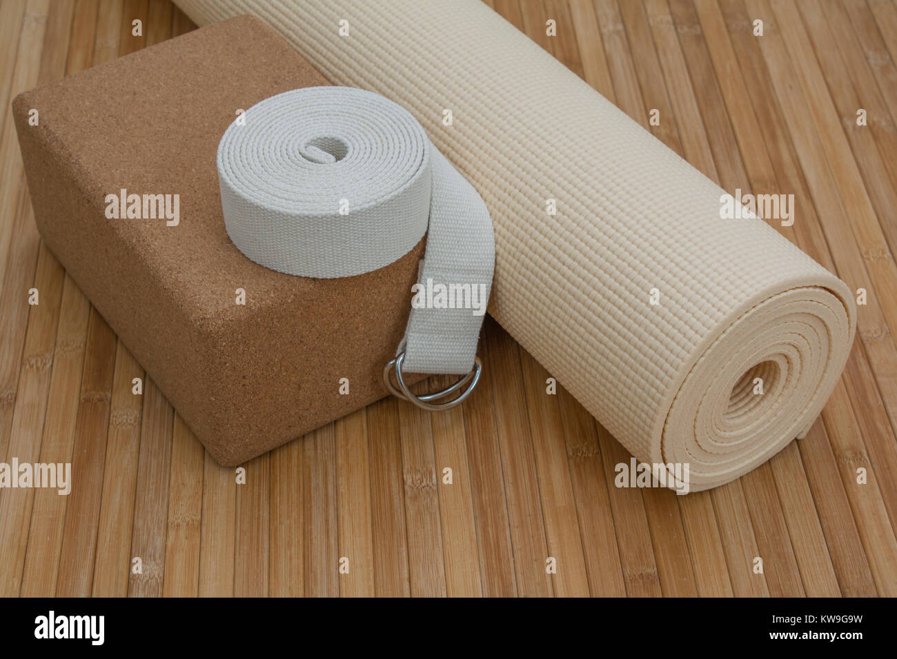 Yoga class supplies on bamboo mat floor ready for yoga retreat Stock
