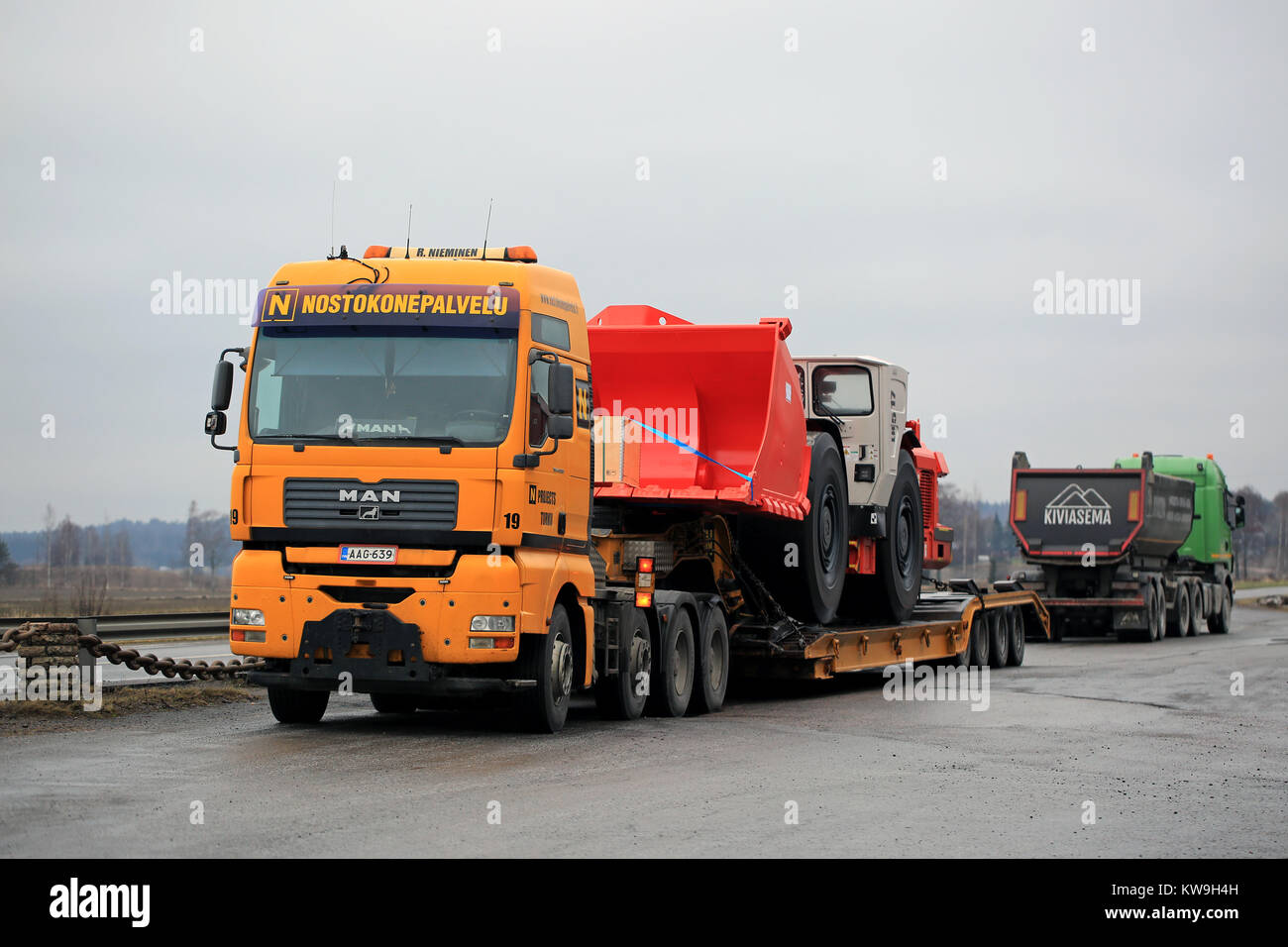 SALO, FINLAND - DECEMBER 28, 2017: MAN TGA 41.530 truck of Nostokonepalvelu is ready to transport Sandvik LH517 Underground Loader. The mining vehicle Stock Photo