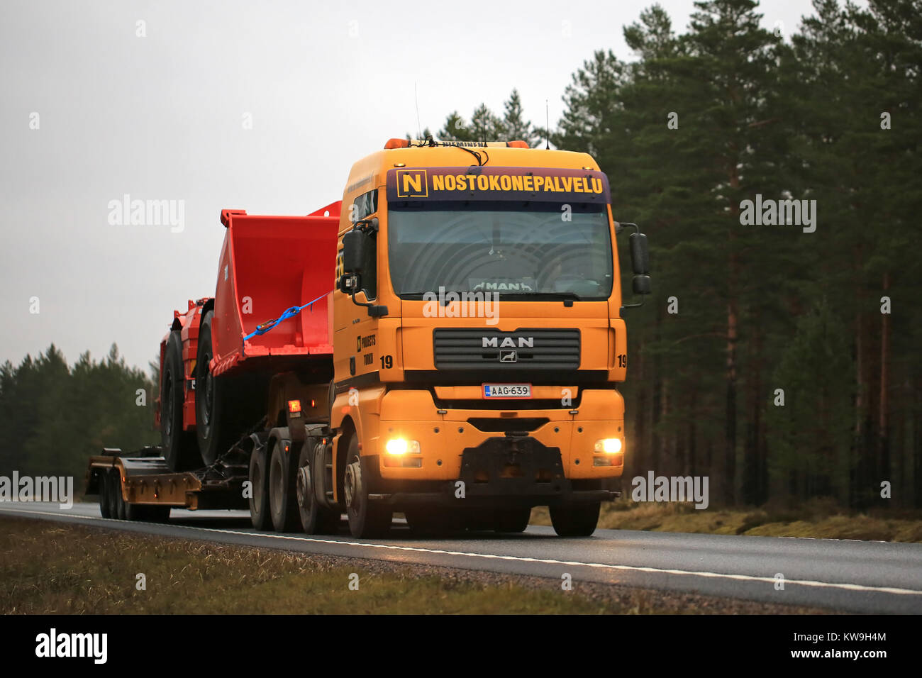 RAASEPORI, FINLAND - DECEMBER 28, 2017: MAN TGA 41.530 truck of Nostokonepalvelu transports Sandvik LH517 Underground loader. The mining vehicle will  Stock Photo