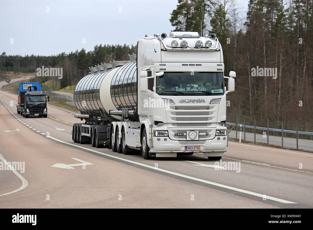 ORIVESI, FINLAND - MAY 17, 2017: Off-white super Scania R580 tank truck of Trans Matti Salo hauls goods on highway among truck traffic in Central Finl Stock Photo