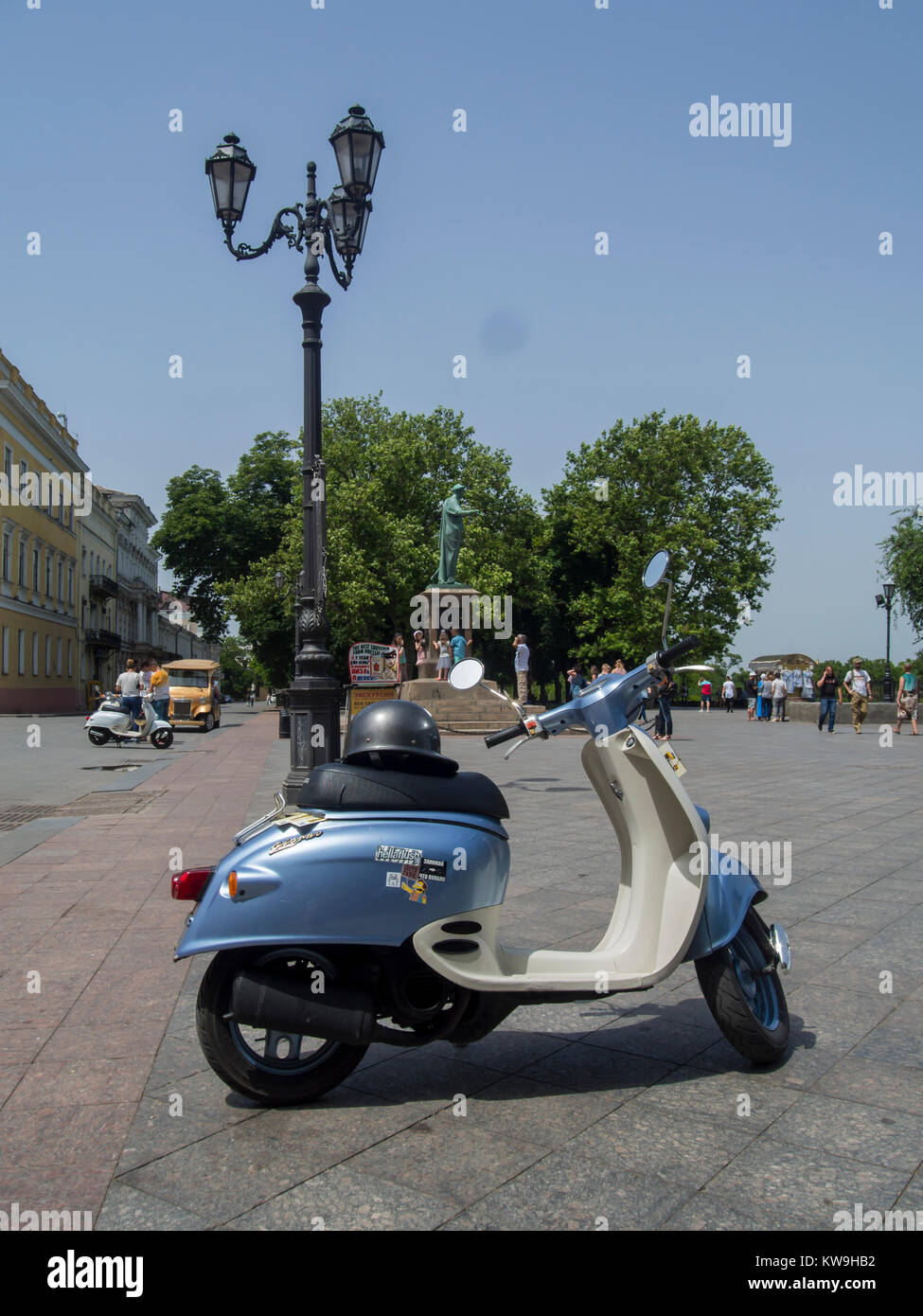 ODESSA, UKRAINE - JUNE 18, 2016:  Scooter on Prymorskyi Blvd with Statue of the Duc de Richelieu in the background Stock Photo