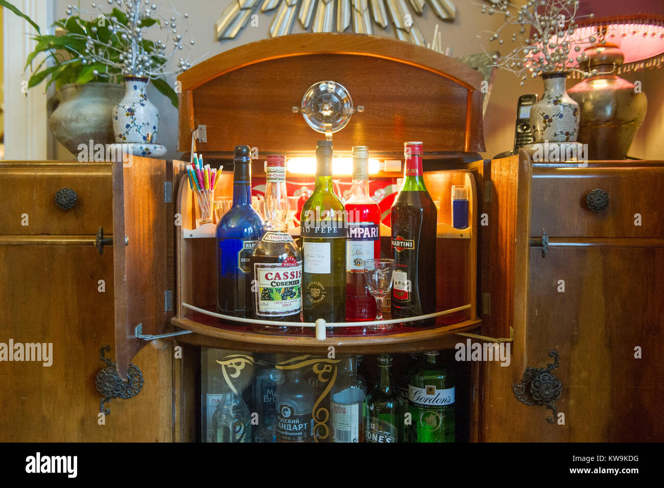 A retro drinks cabinet with chic 1970's drinks Stock Photo - Alamy
