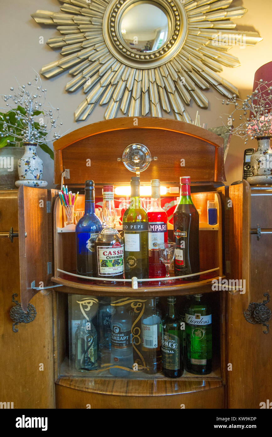 A retro drinks cabinet with chic 1970's drinks Stock Photo - Alamy