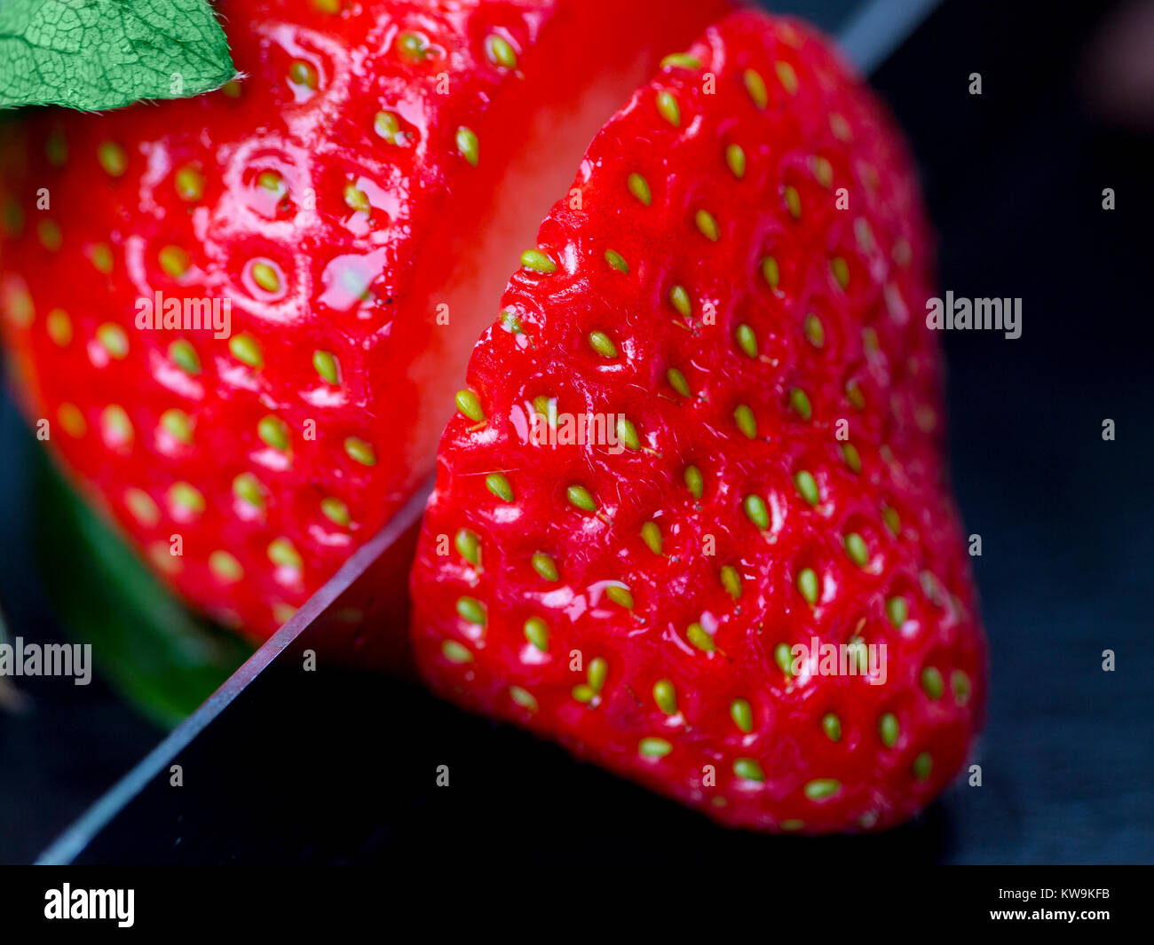 A macro photograph of a fresh sliced strawberry Stock Photo - Alamy