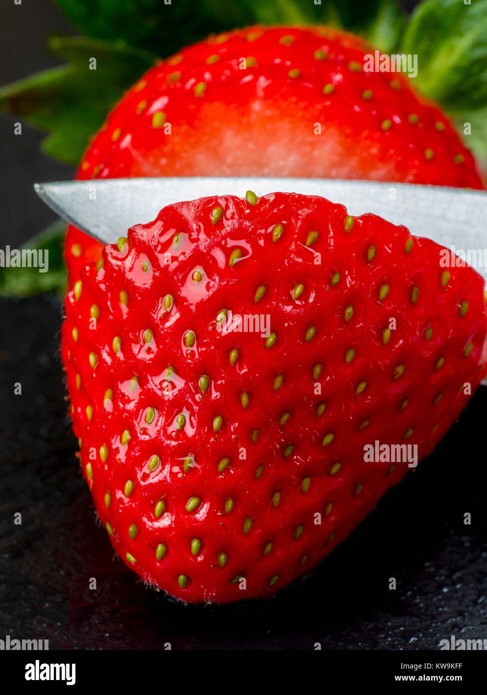 A macro photograph of a fresh sliced strawberry Stock Photo - Alamy