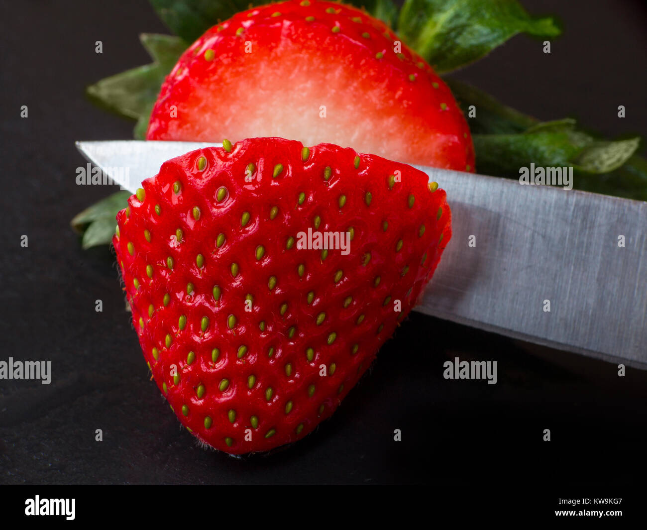 A macro photograph of a fresh sliced strawberry Stock Photo - Alamy