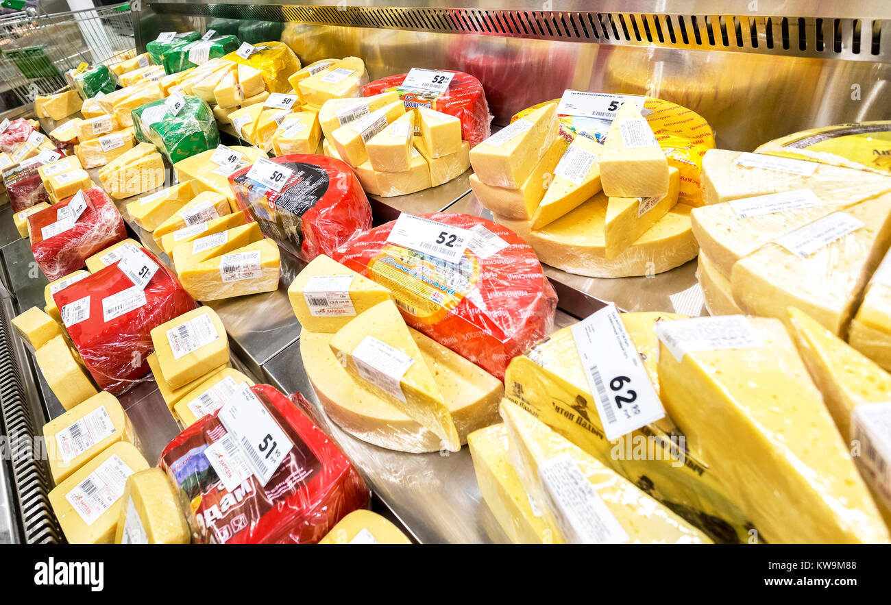 Samara, Russia - November 19, 2017: Tasty cheese in the showcase ready to sale in supermarket Karusel. Russia's largest food retailer Stock Photo
