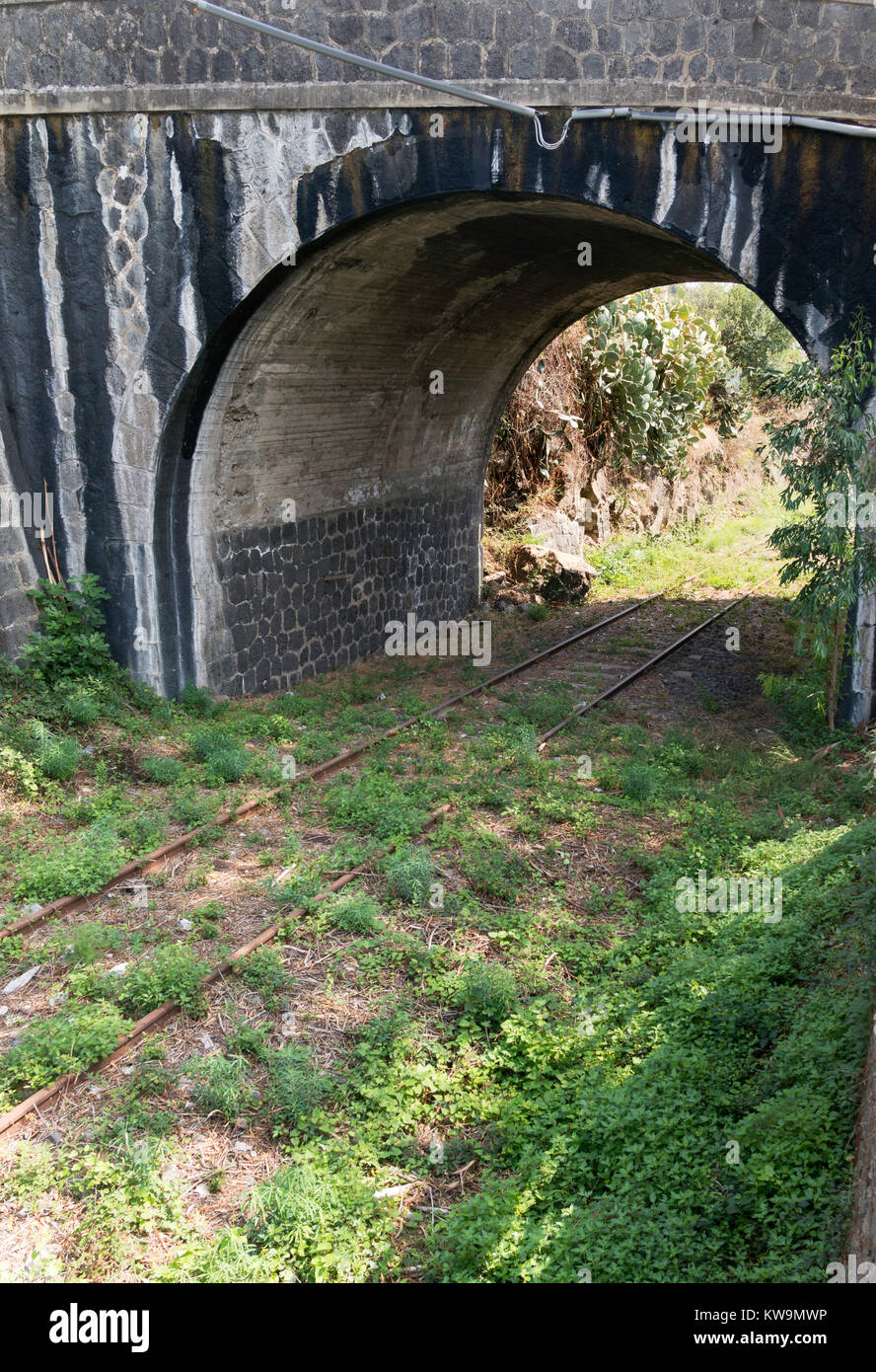 An abandoned railway track near the Gole Alcantara geologic park, Sicily, Europe Stock Photo