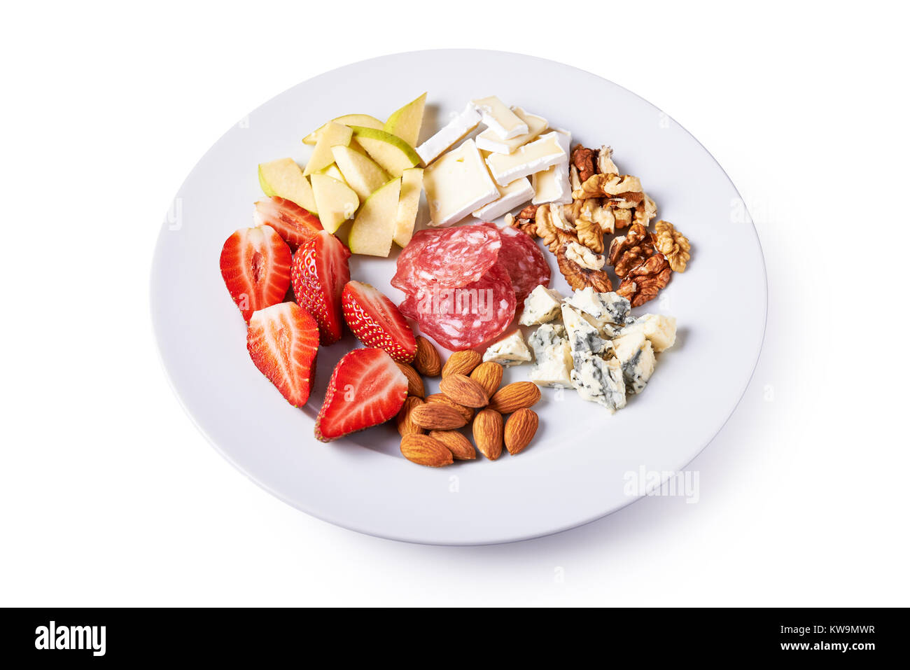 cheese board with fruits and nuts isolated on white background Stock Photo