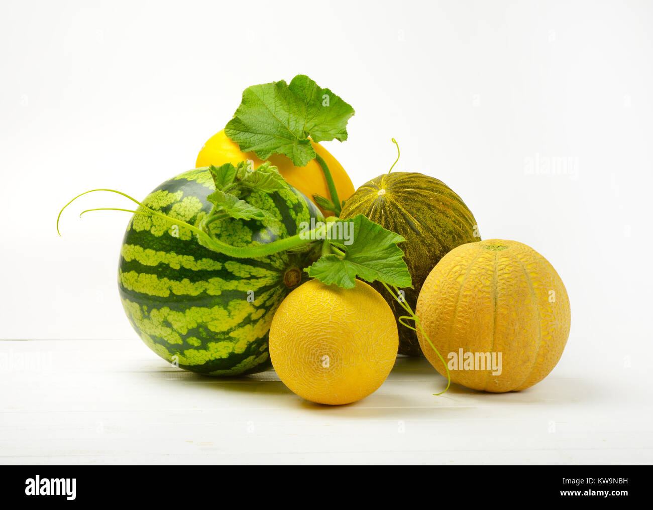 various types of melon on white wooden background Stock Photo Alamy