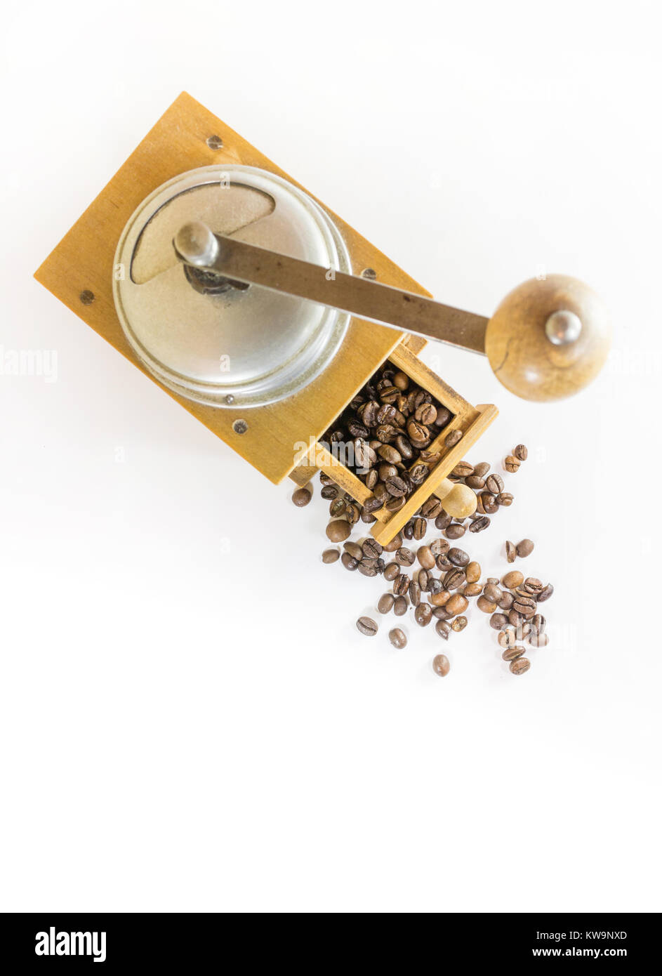 https://c8.alamy.com/comp/KW9NXD/wooden-vintage-coffee-grinder-and-roasted-coffee-beans-isolated-on-KW9NXD.jpg