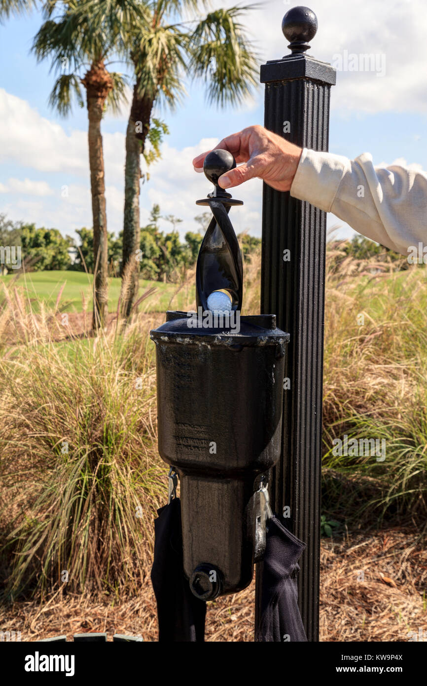 Black golf ball cleaner station on a golf course Stock Photo - Alamy