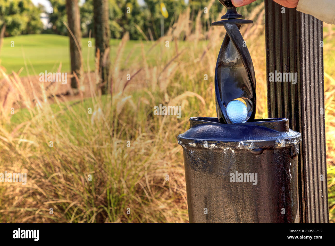 Black golf ball cleaner station on a golf course Stock Photo Alamy