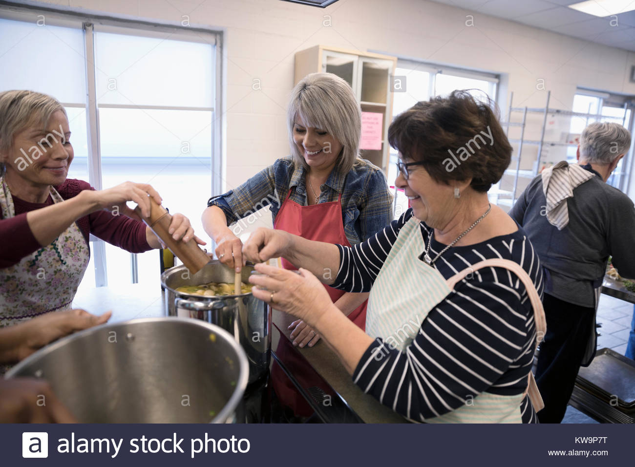 Female volunteers cooking in soup kitchen Stock Photo Alamy
