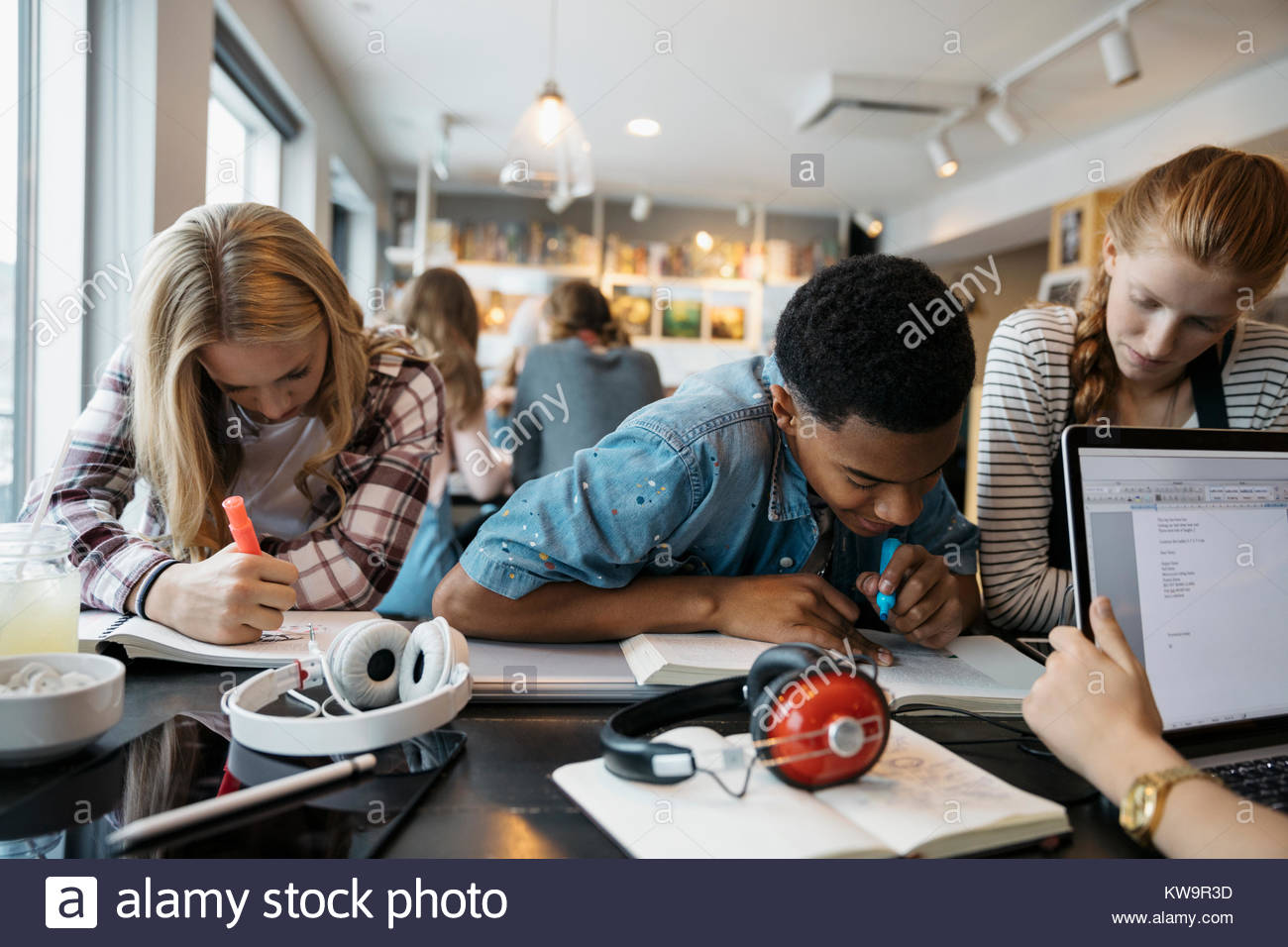 High school students studying at cafe table Stock Photo Alamy