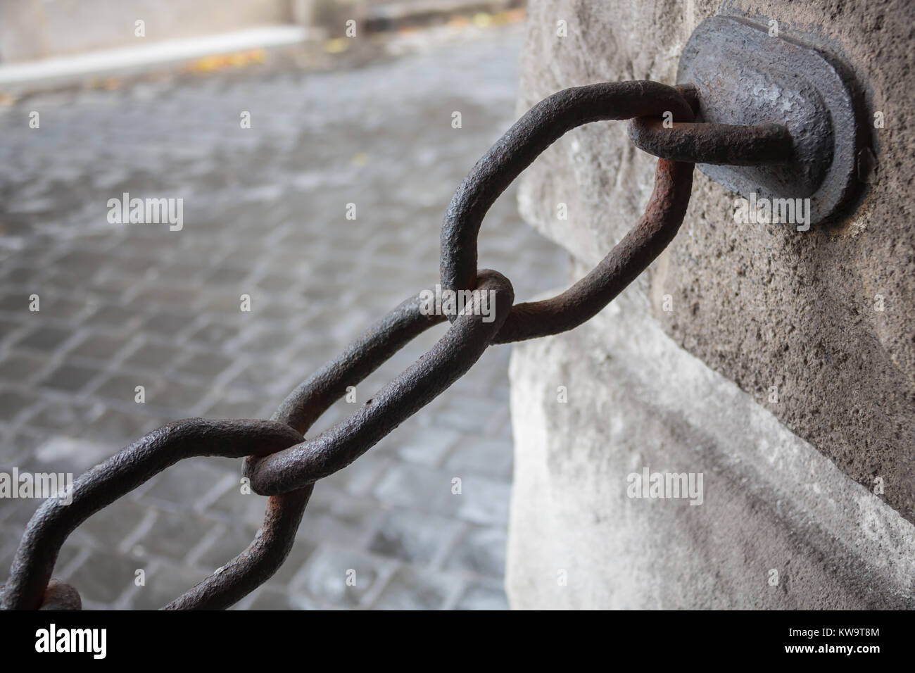 Old metal chain on water background in the sunlight Stock Photo