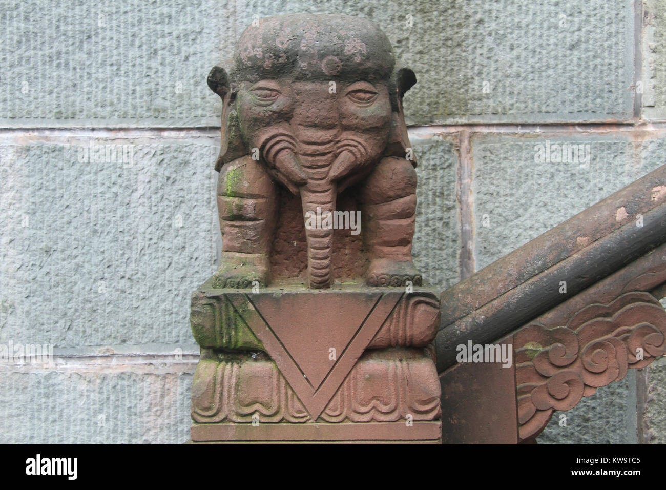 Stone elephant near wall in buddhist temple, China Stock Photo