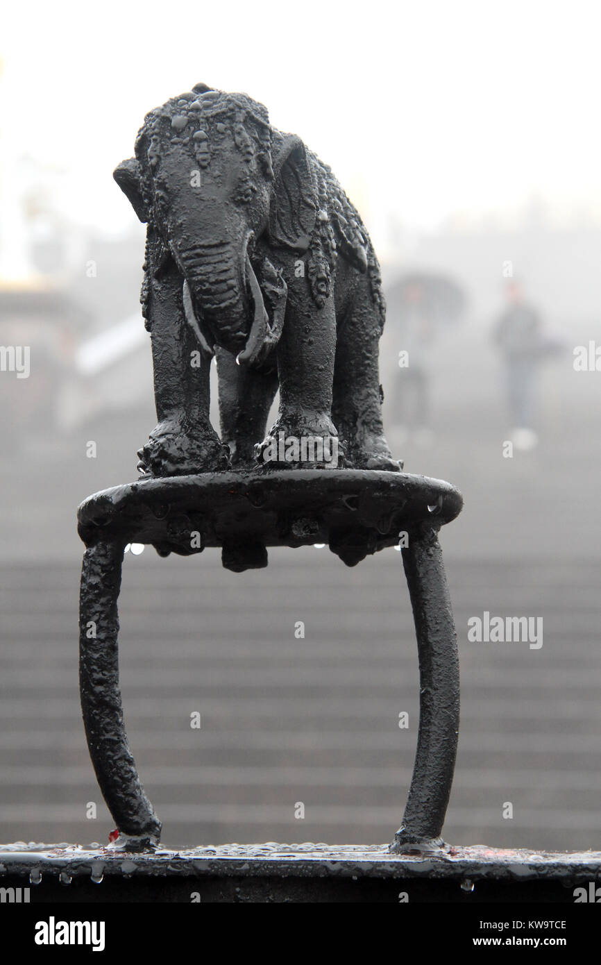 Sculpture of wet black elephant on the top of buddhist shrine in China Stock Photo