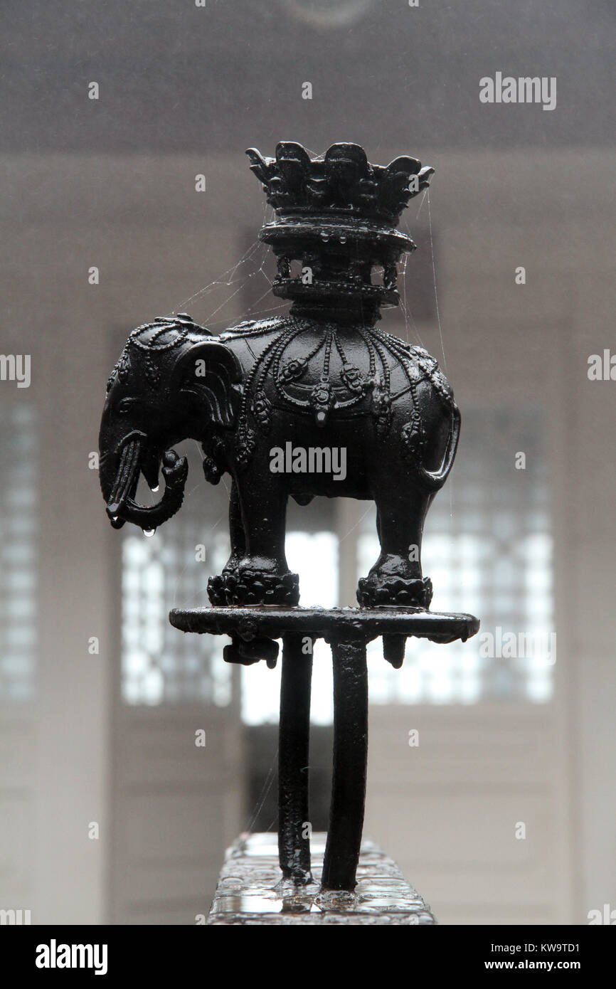 Wet sculpture of black elephant on the buddhist shrine Stock Photo