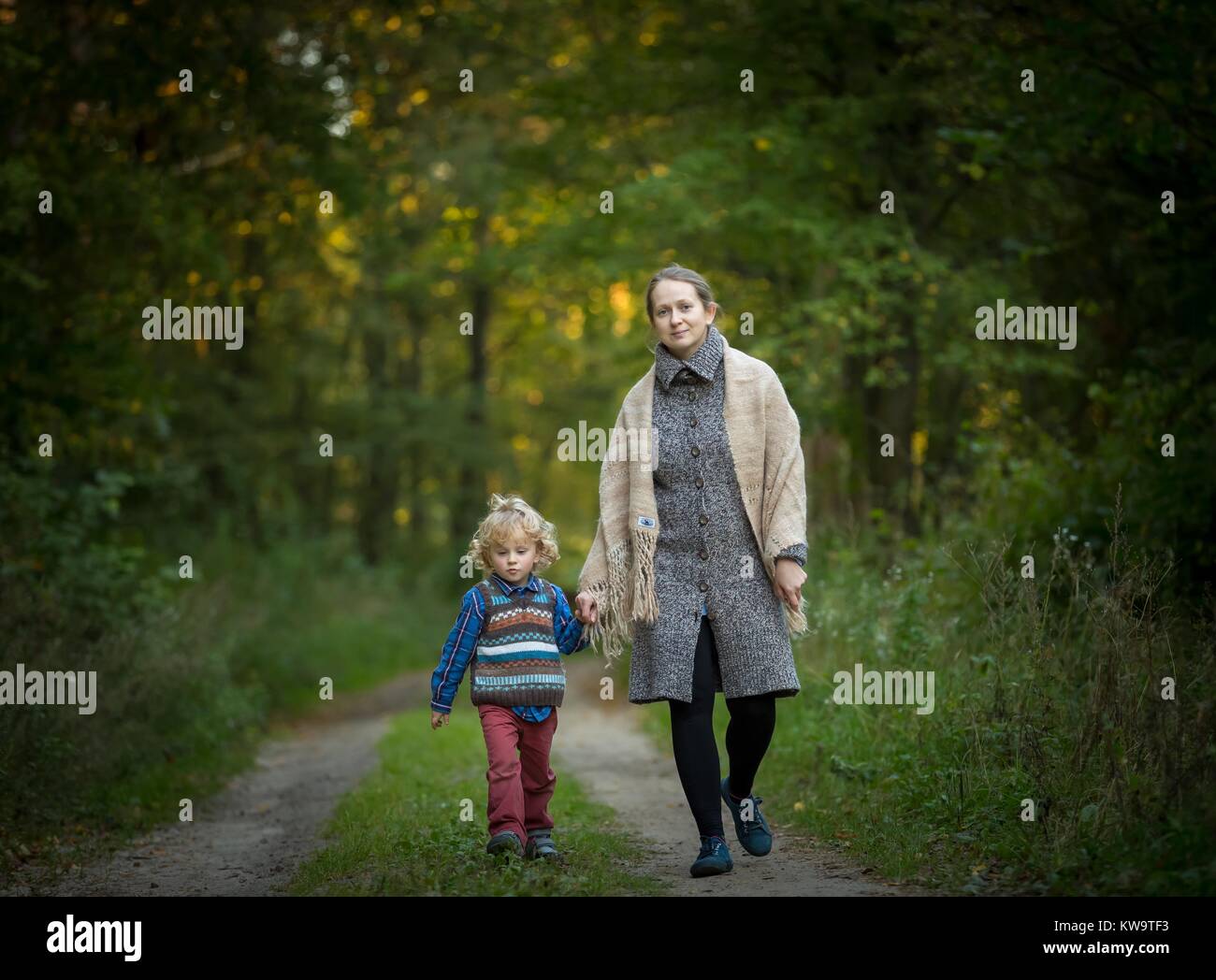 Mother and son together in forest Stock Photo