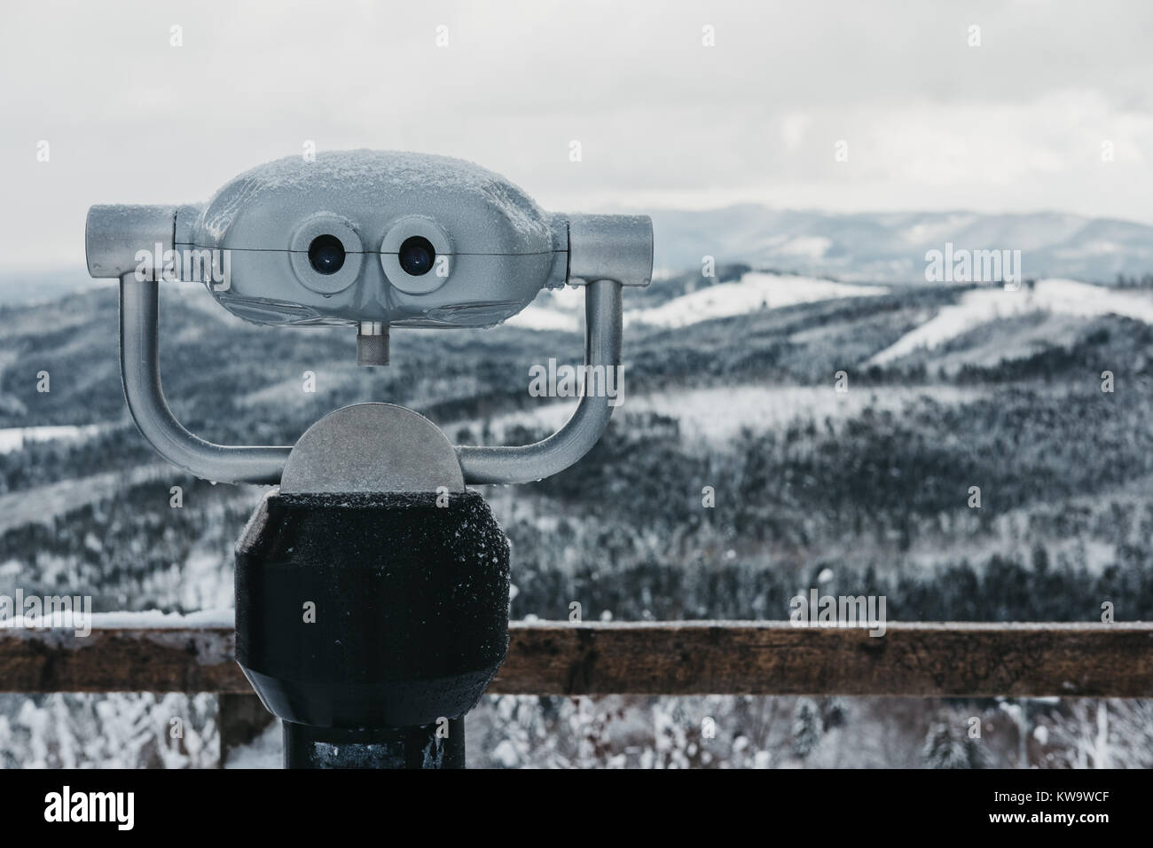 Binoculars in Bukovel ski resort, snow, mountains and trees on the background. Bukovel is one of the most popular winter sport resorts in Ukraine. Stock Photo