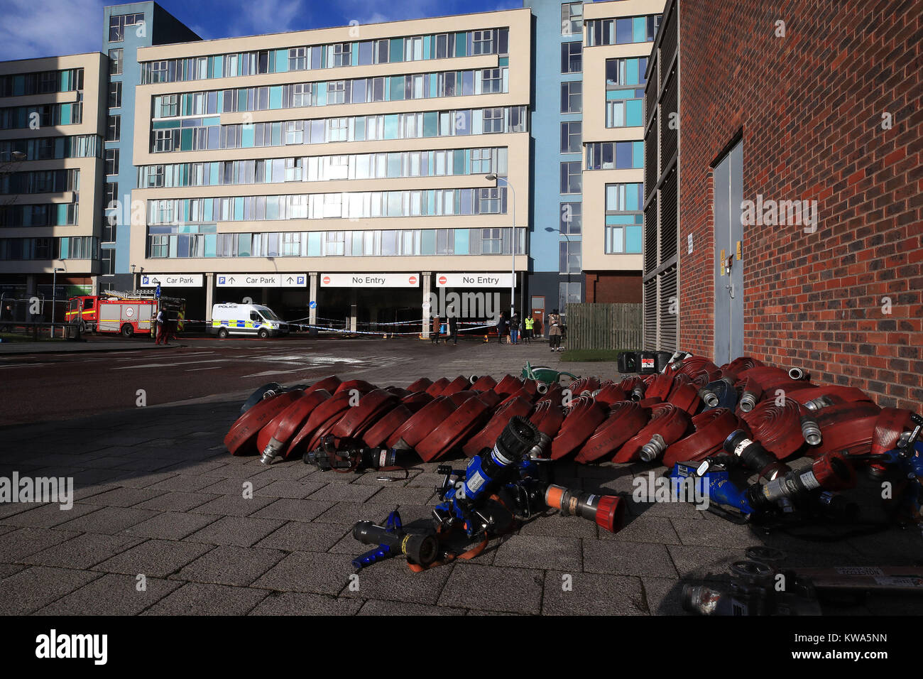 Firefighting equipment at the multi storey car park near the Echo Arena in Liverpool, after last night's fire which destroyed hundreds of cars. Stock Photo
