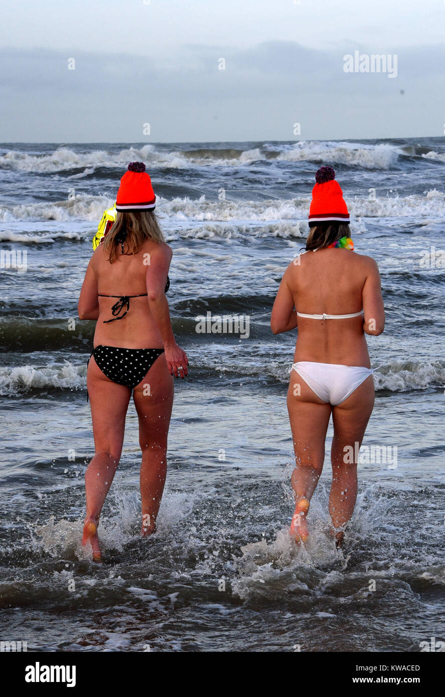 Two water nymphs bustle in the 8 degrees Celsius cold water of the North  Sea in Noordwijk, Netherlands, 01 January 2018. The New Year's Swim is an  old Dutch tradition, being practised