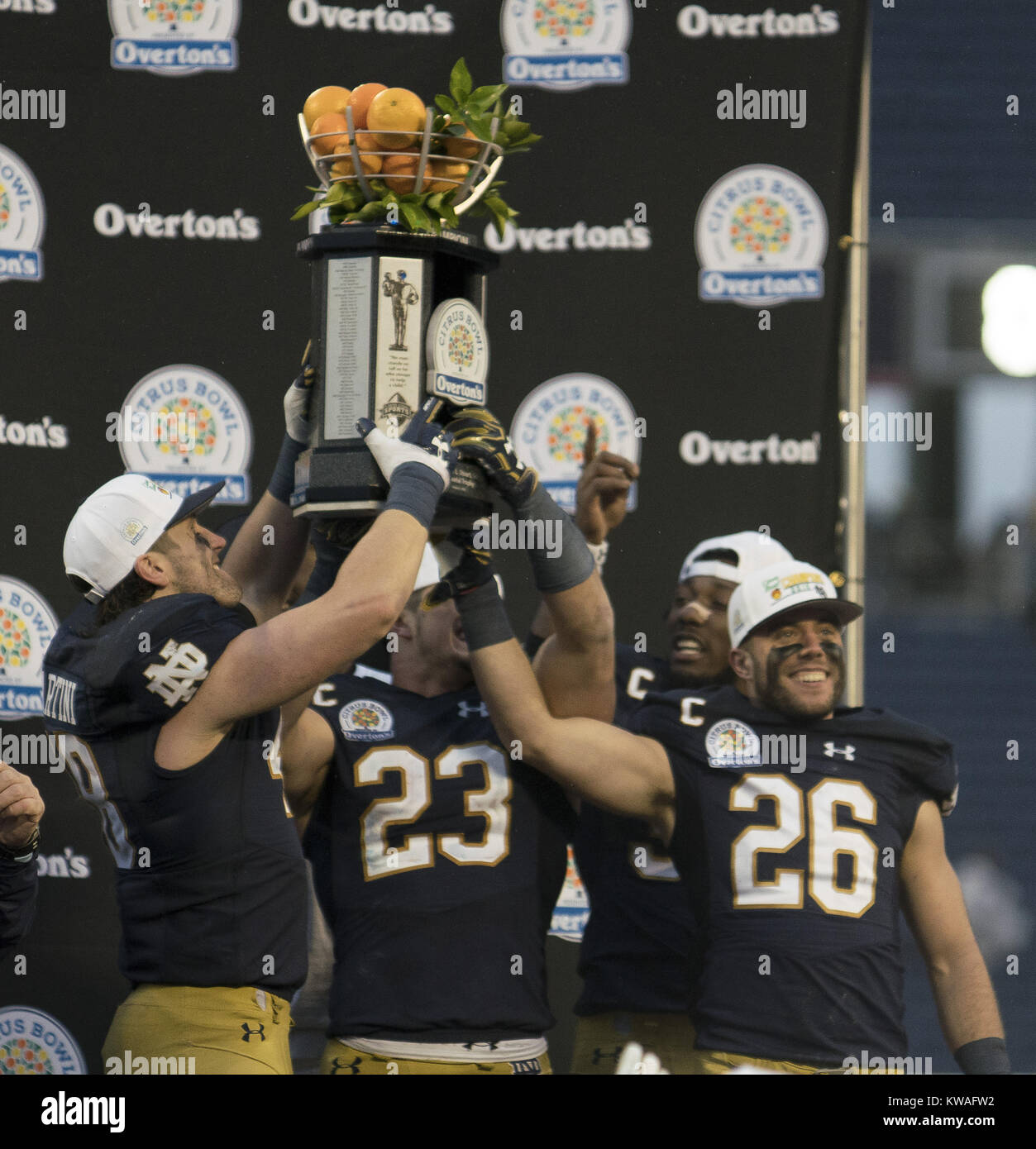 Orlando, Florida, USA. 1st January, 2018. Notre Dame Players holds up the winning trophy of the Florida Citrus Bowl at Camping World Stadium. Credit: Jerome Hicks/ZUMA Wire/Alamy Live News Stock Photo