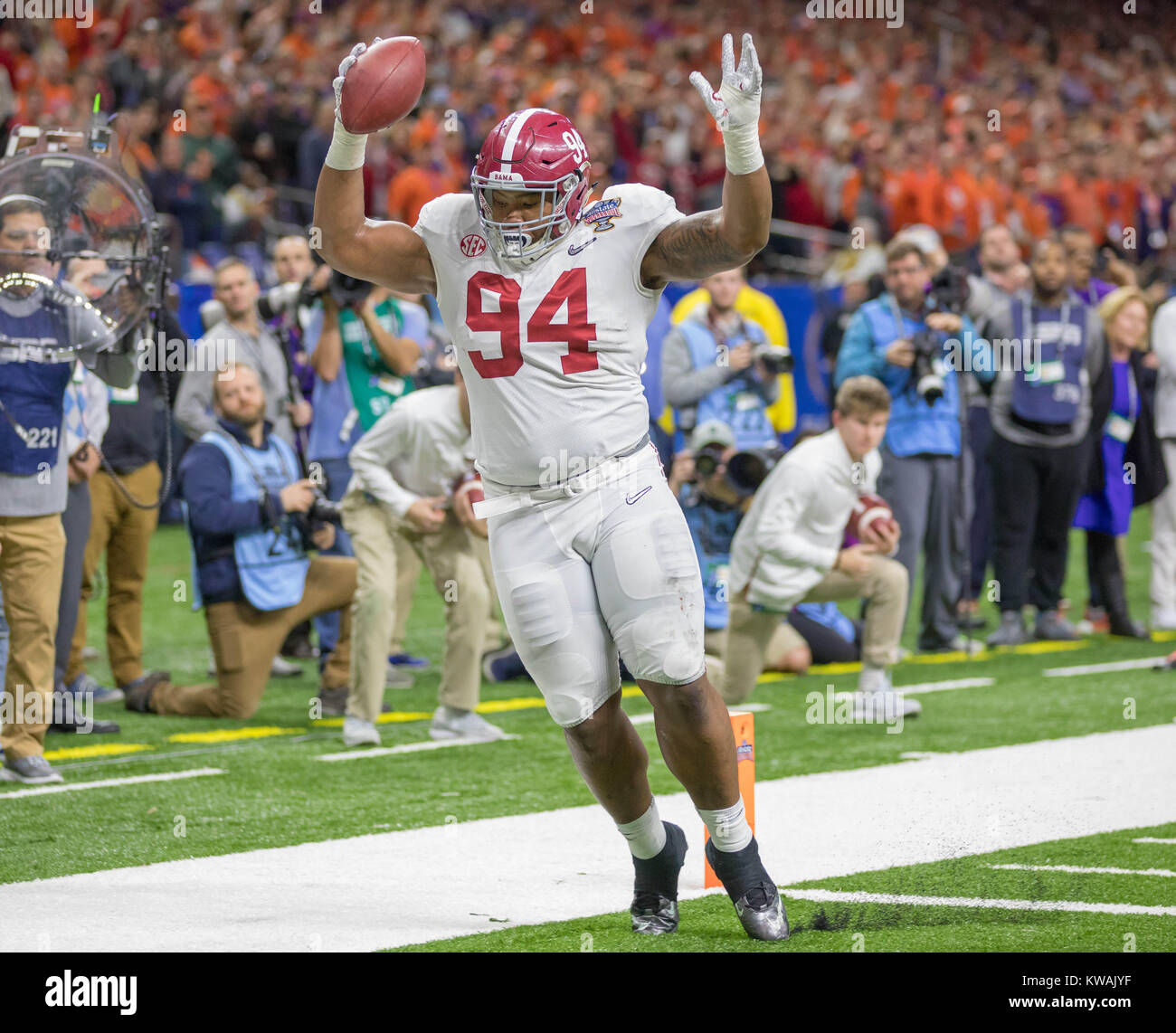 New Orleans, LA, USA. 1st Jan, 2018. Alabama defensive lineman Da'Ron Payne #94 scores a touchdown while playing on offense during the Allstate Sugar Bowl football game between the Clemson Tigers and the Alabama Crimson Tide at the Mercedes-Benz Supedome in New Orleans, LA. Kyle Okita/CSM/Alamy Live News Stock Photo