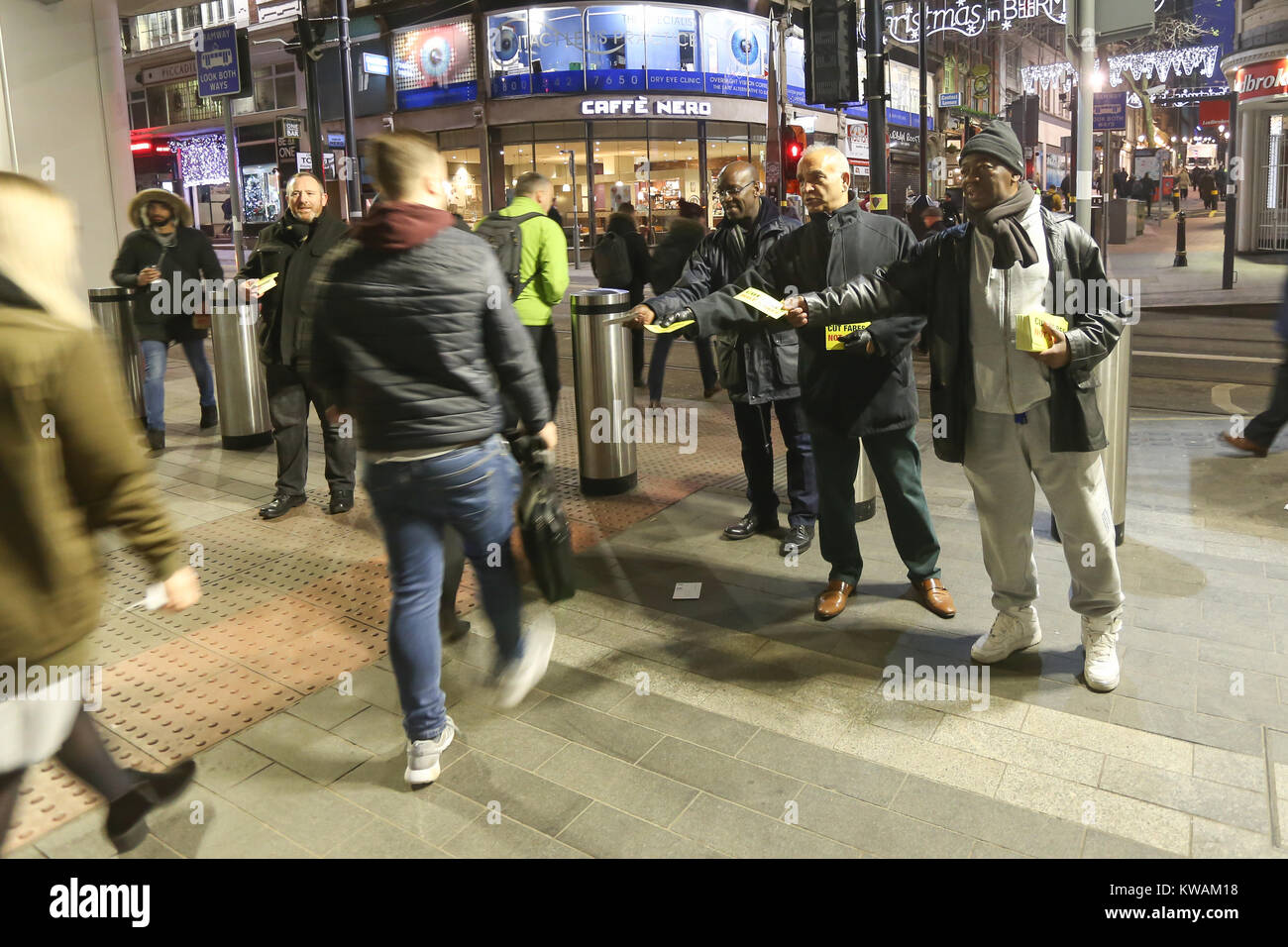 Birmingham New Street, UK. 2nd Jan, 2018. Rail Maritime and Transport Union officials hand out leaflets to commuters outside New Street Station, Birmingham, stating that rail passengers are paying too much for their rail fares after a rise in rail fares comes into effect today. Credit: Peter Lopeman/Alamy Live News Stock Photo