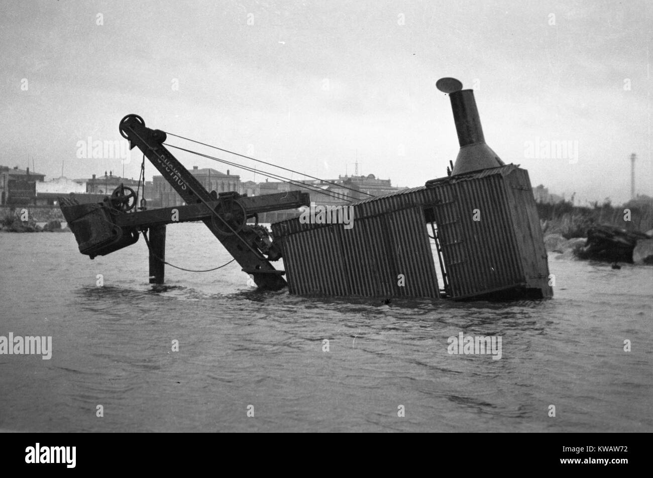 Steam-powered digger submerged in the Grey River, Greymouth, Westland, New Zealand, probably 1930s Stock Photo