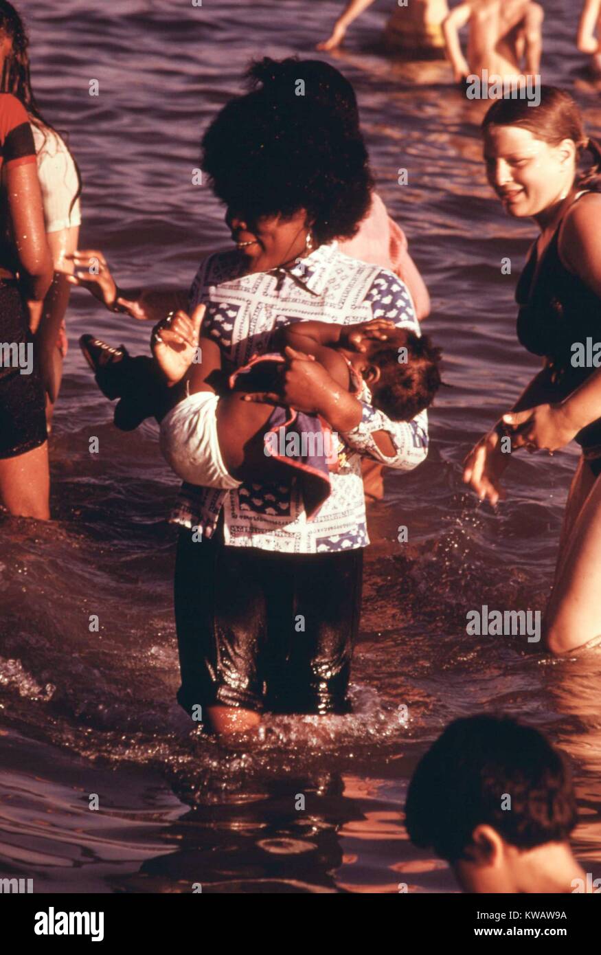 Chicago families socialize in the sun at the 12th Street beach on Lake  Michigan, Illinois, August, 1973. Image courtesy John White/US National  Archives Stock Photo - Alamy