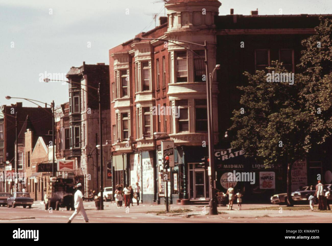 View of a community in the South Side of Chicago with small businesses and apartments over stores in older buildings, near 43rd and Indiana Avenue, Illinois, June, 1973. Image courtesy National Archives. Stock Photo