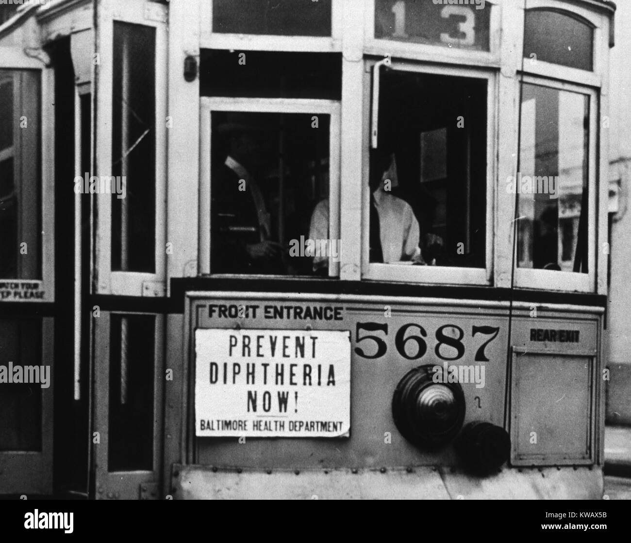 Close up of a sign on a trolley about preventing diphtheria, Baltimore, Maryland, 1950. Courtesy National Library of Medicine. Stock Photo