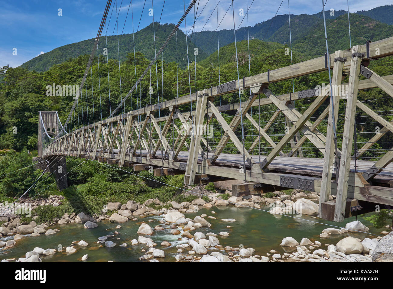 Historical wooden Tosuke suspension bridge in Nagiso, on the Nakasendo Trail - Nagano Prefecture, Honshu, Japan Stock Photo