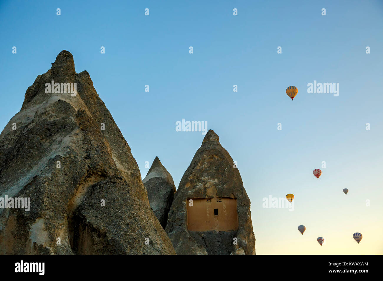 Fairy chimneys and hot air balloons, near Goreme, Cappadocia, Turkey Stock Photo