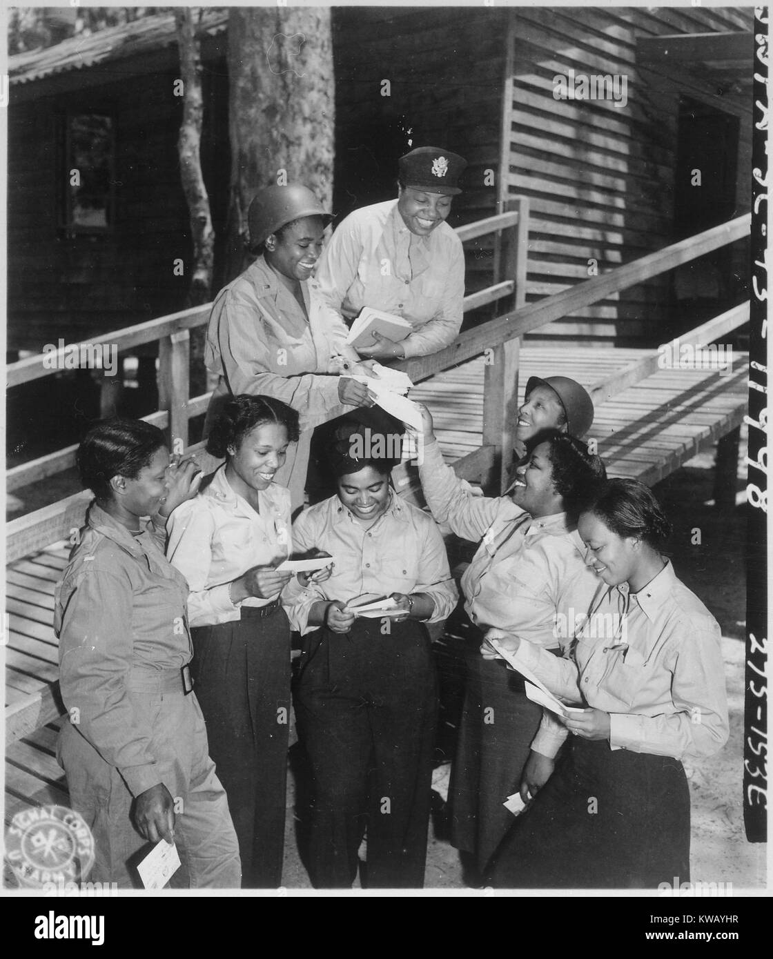 A contingent of fifteen nurses arrive in the Southwest Pacific area after receiving their first batch of home mail at their station at the 268th Station Hospital in Australia, November 29, 1943. Image courtesy National Archives. Stock Photo