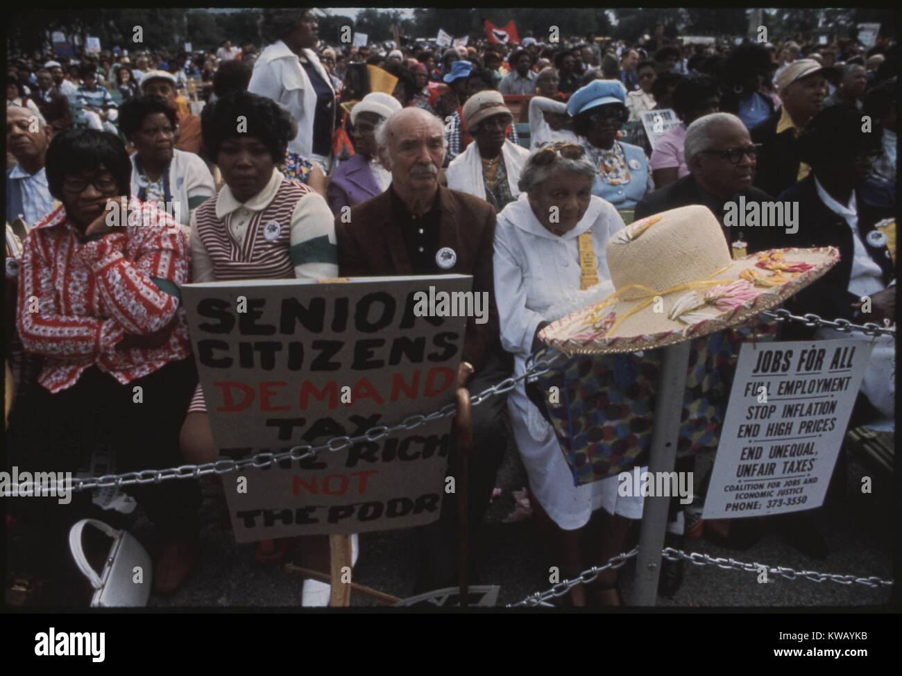 Senior Citizens stop along Lake Shore Drive in Chicago, Illinois to hear speeches during a march led by Reverand Jesse Jackson and Operation PUSH to protest inflation, unemployment, and high taxes, October, 1973. Stock Photo