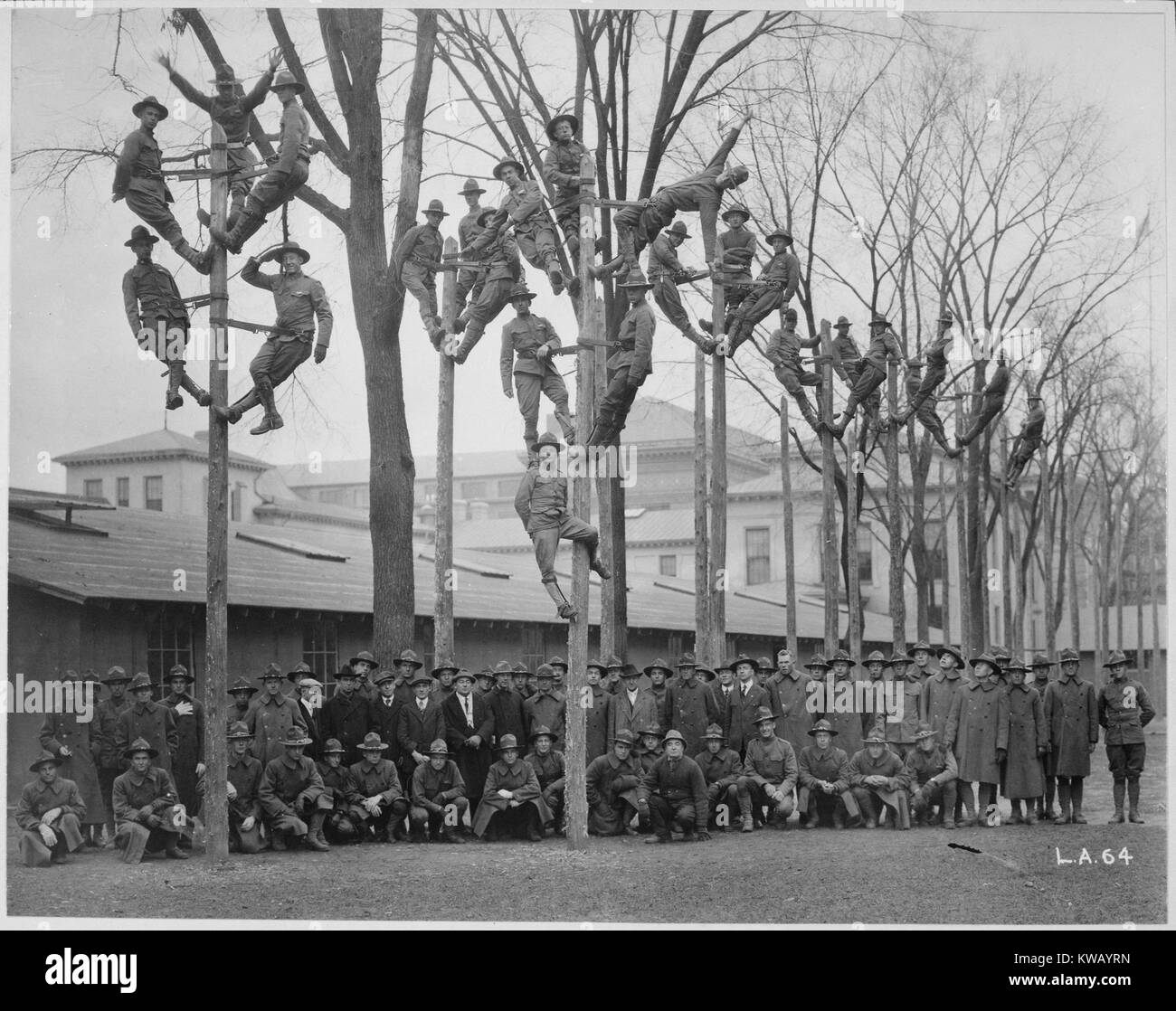 Students and instructors of a Pole-Climbing course for telephone electricians during Student Army Training Corps (SATC) vocational training at the University of Michigan, Ann Arbor, Michigan, 1918. Image courtesy National Archives. Stock Photo