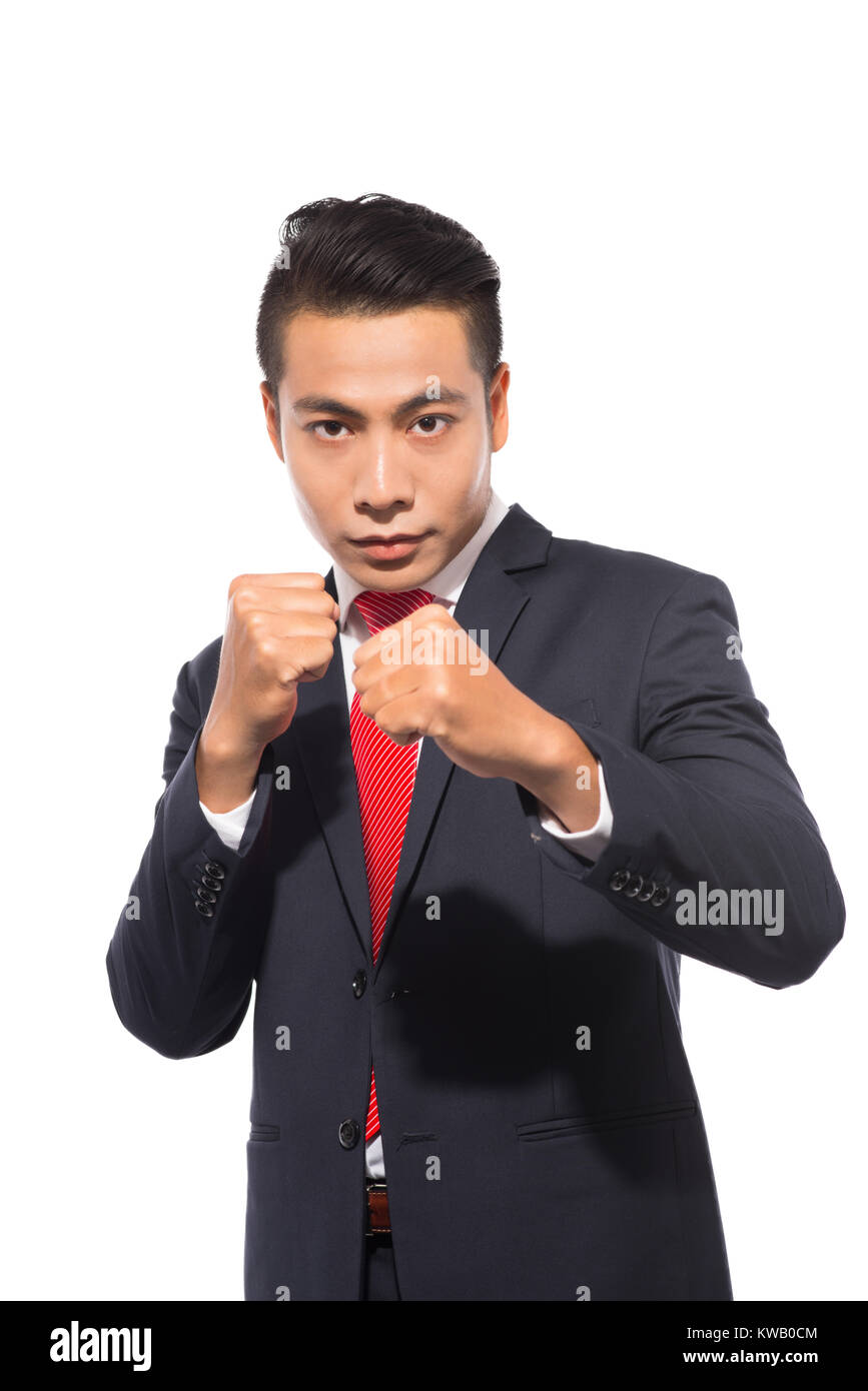 Young asian businessman ready to fight isolated on white Stock Photo